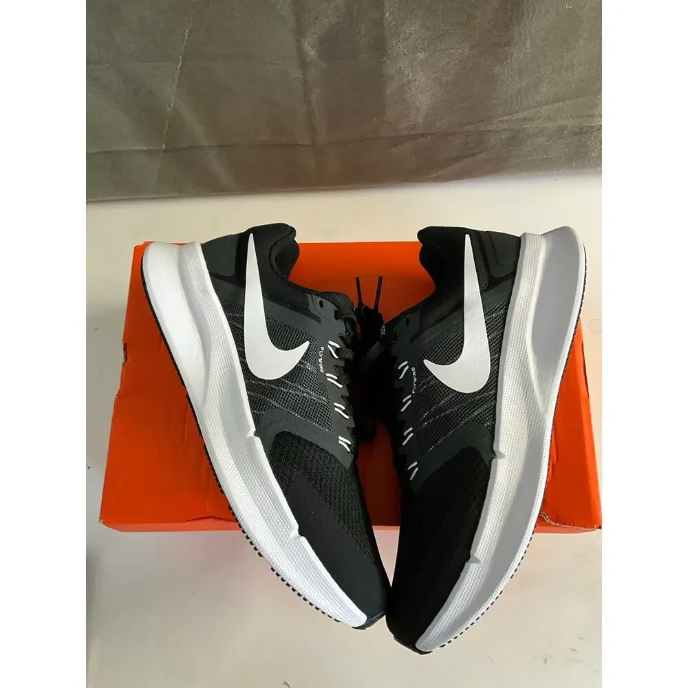 Nike Run Swift 3 sneakers in black and white